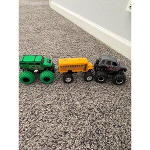 MONSTER TRUCKS LOT OF THREE VARIOUS TRUCKS BUS